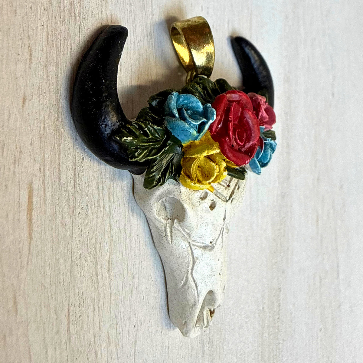 Angled close-up of floral bull skull western hat charm style 3 showing colorful rose detail