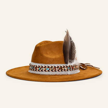 Finished khaki custom western hat with its original woven band, white frayed ribbon and natural feathers on warm ivory