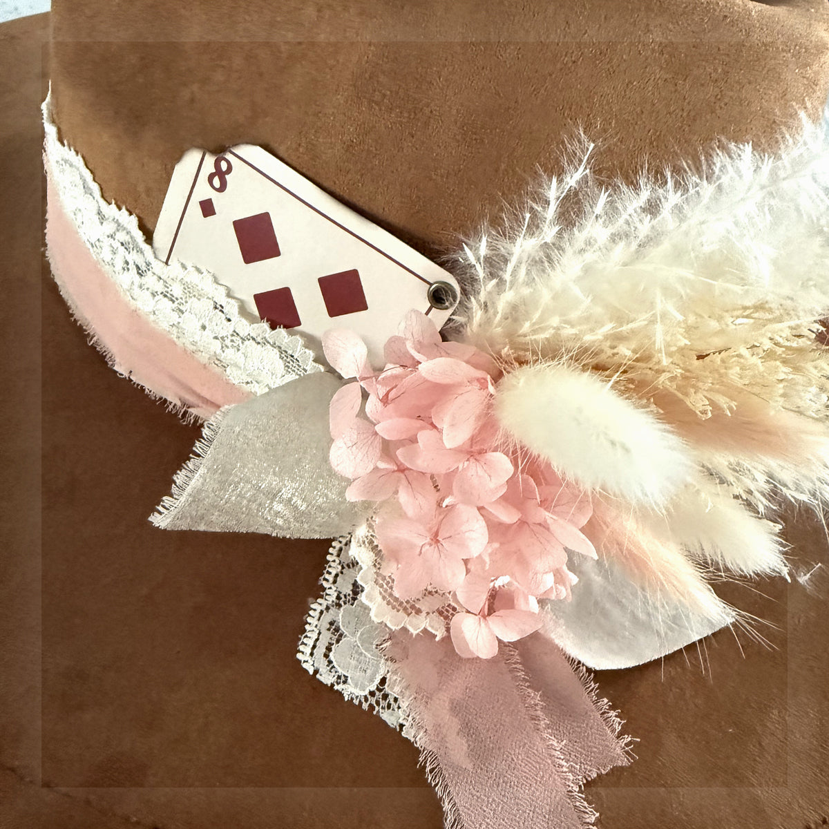 Beautified lifestyle view of the exact eight of diamonds playing card add-on styled with pink ribbon, lace, feathers and florals