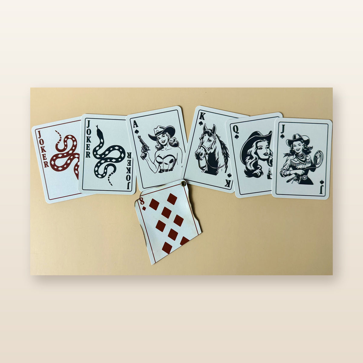 Beautified catalog view of exact Western Outlaw playing card options including snake jokers and western illustrated face cards