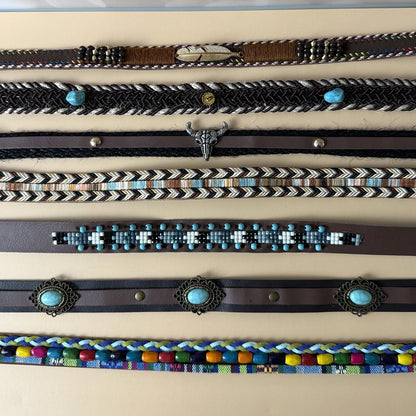 Assorted western hat bands with turquoise, bull skull, braided, beaded and concho details