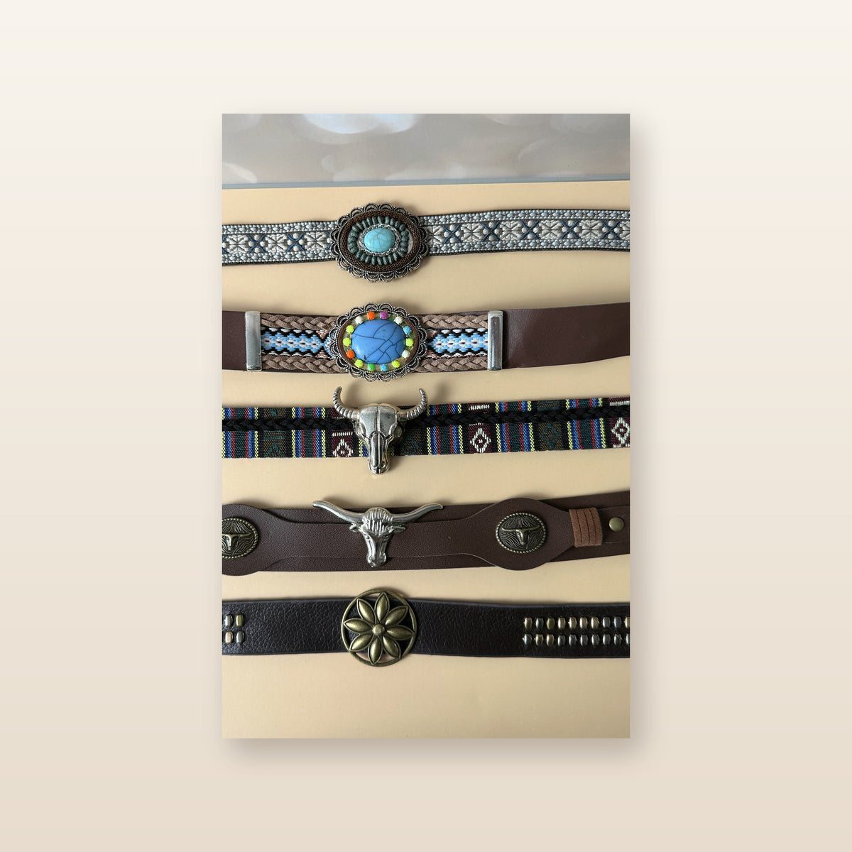 Beautified close catalog view of the exact western hat bands with turquoise, bull skull, leather and studded details