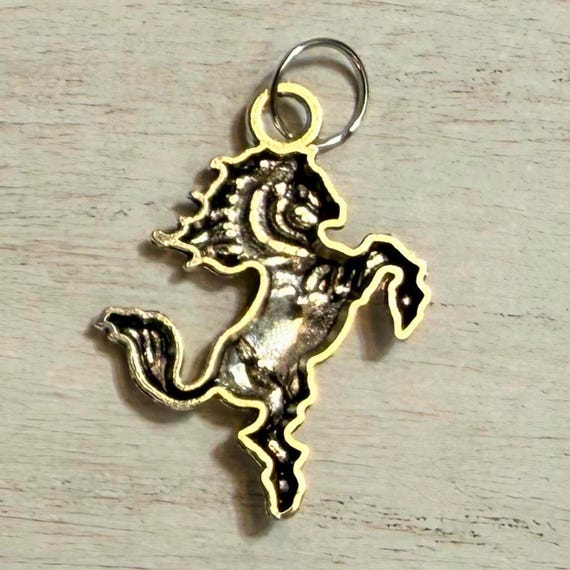 Running horse western hat charm closeup