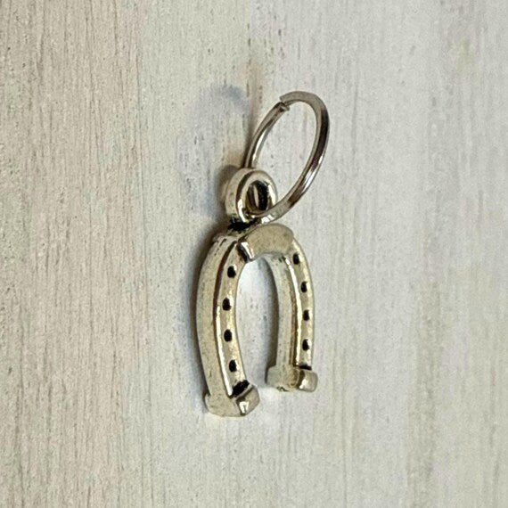 Silver western charm closeup
