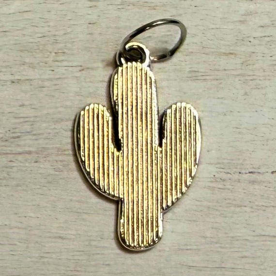 Western metal cactus charm closeup